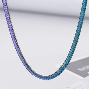 Macro shot of a 5mm blue-purple gradient snake bone chain with polished metal texture