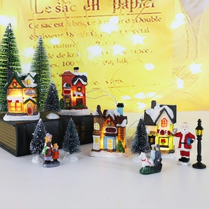 Lighted Christmas resin village set with miniature houses, trees and Santa figurines