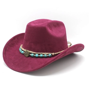 Detail of magenta faux suede cowboy hat with braided rope and turquoise bead accents
