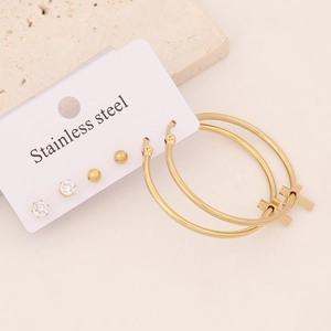 Gold stainless steel set featuring cross hoop earrings and heart stud earrings
