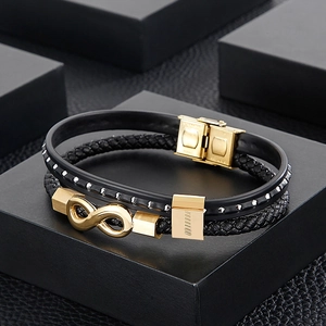 Detail of multi-layer braided leather bracelet with golden infinity steel symbol