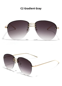 Detail view of gradient gray pilot sunglasses with golden metal temples and triple-bridge