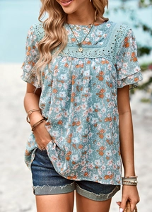 Detail of square neckline with white lace trim and floral print on summer top