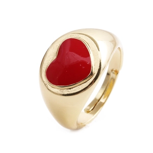 Detail view of a gold-plated adjustable ring with red enamel heart and star accents