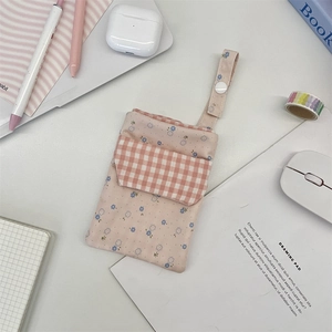Pink floral canvas nurse pouch detail with white snap strap and grid pocket design