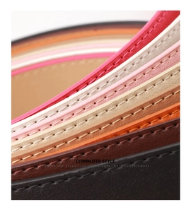 Macro shot of colorful leather belts showing detailed stitching and premium grain texture
