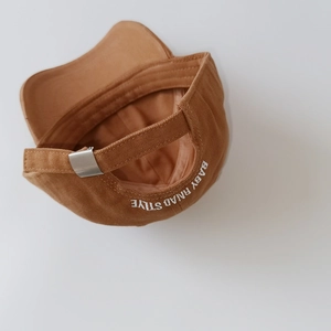 Detail view of cotton kids baseball cap with back embroidery and adjustable buckle
