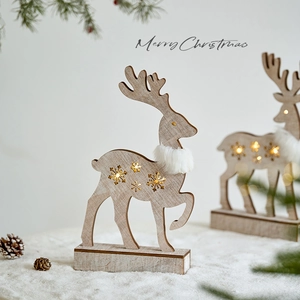 Wooden Christmas reindeer ornament with LED lights and white faux fur on a cozy winter background