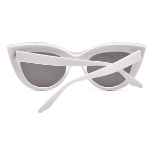 White cat eye sunglasses with rhinestones and dark grey lenses on white background