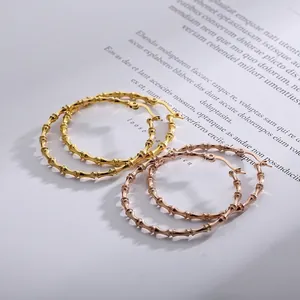 Chic geometric bamboo style stainless steel hoop earrings in gold and rose gold finish