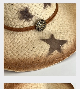 Detail of hand-woven straw hat featuring vintage metal buckle and star pattern