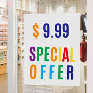 Close-up of retail window display featuring a special offer poster priced at 9.99 dollars