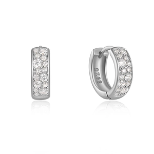 Macro shot of 925 sterling silver hoop earrings with small clear inlaid stones and S925 hallmark