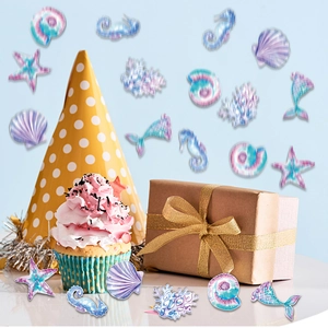 Mermaid birthday party table confetti with seahorse starfish shells and coral shapes