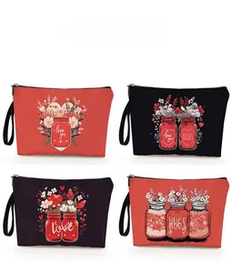 Detail of four heart-patterned makeup bags featuring Love You and Kiss prints