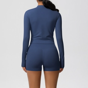 Rear view of navy blue high-stretch yoga set with slim fit long sleeve top and shorts