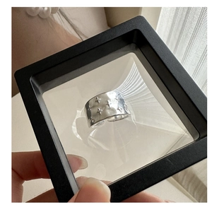 Close-up of S925 sterling silver star ring with hammer texture in a black jewelry box