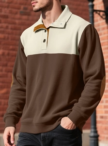 Detail of men's brown corduroy polo shirt with contrast collar and button neckline