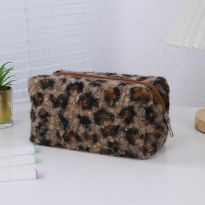 Detailed view of plush leopard print makeup bag with a high-quality metal zipper closure