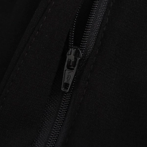 Elegant black sleeveless jumpsuit with smooth metal zipper detail and fine fabric texture