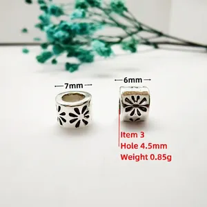 Detailed macro of 7mm antique silver flower beads with 4.5mm hole for DIY jewelry making