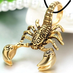Vintage gold scorpion pendant necklace with antique finish on a black braided cord