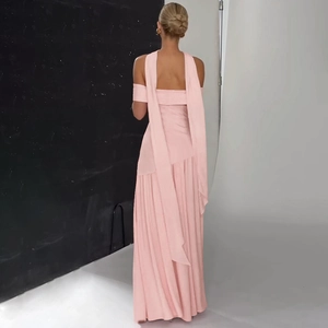 Detail of pink off-shoulder long dress showing flowing back streamers and elegant pleats