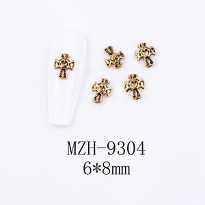 Macro detail of vintage 3D cross nail charms with dimensions 6x8mm and model MZH-9304