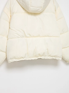 Detail of hooded padded coat back with clean diamond quilting and premium stitching