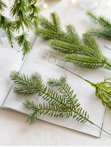 Detailed close-up of artificial green pine needles branches for DIY Christmas wreaths