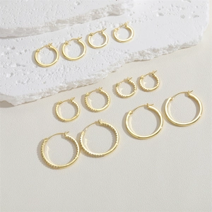 Set of 14K gold plated hoop earrings with zircon pavé and polished finish on stone surface