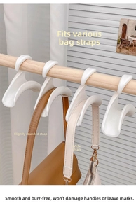 Detailopname van een witte plastic tashak met breed gebogen ontwerp ter bescherming van riemen