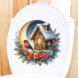 Christmas wall decal with snow house, moon, and bird on a white toilet lid surface