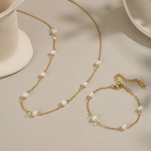 Detail of 18K gold plated necklace and bracelet set with natural freshwater pearls