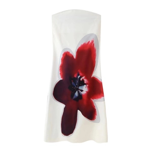 Elegant sleeveless strapless maxi dress in white with vibrant red floral print