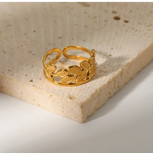 Detailed macro view of 18k gold plated leaf ring with intricate vein texture on stone