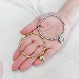 18K gold and silver plated beaded elastic bracelets with vintage heart charms on hand