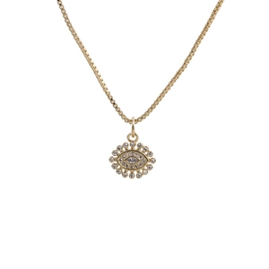Close-up of gold Evil Eye pendant with cubic zirconia inlay and box chain on white