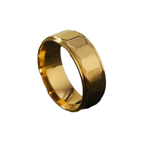 Minimalist 8mm faceted gold stainless steel ring with a polygon texture on white background