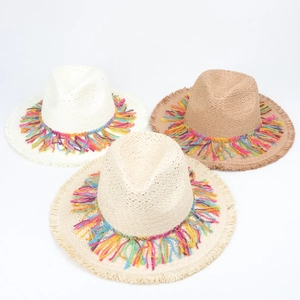 Detailed top view of summer straw hats with colorful fringe tassels in three shades