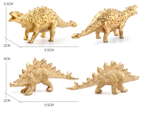 Detailed view of golden Ankylosaurus and Stegosaurus figurines with scale measurements