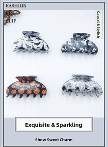 Set of four Halloween acrylic hair claws featuring bat, ghost, pumpkin and spider designs