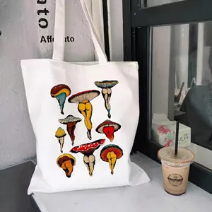 Canvas tote bag featuring a surrealist mushroom and legs print in artistic white