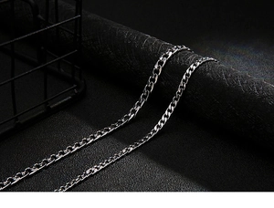 Macro shot of silver titanium steel NK Cuban chain with high polish finish and hip-hop style
