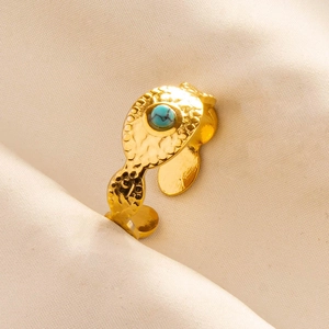 Detail of gold hammer-textured 304 stainless steel ring with a turquoise stone inlay