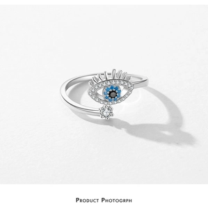 Close-up of S925 silver Evil Eye ring with blue cubic zirconia and hanging stone detail