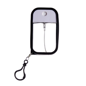 Detail of 50ml portable spray bottle with black frame, transparent body and clip