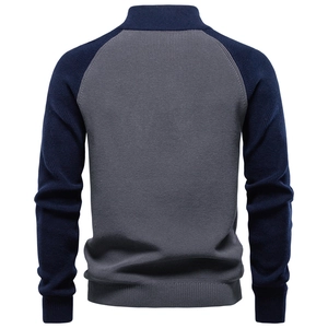 Back view of grey and dark blue color-block knit sweater with ribbed cuffs and hem