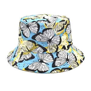 Close-up of butterfly print reversible bucket hat in vibrant blue and yellow cotton