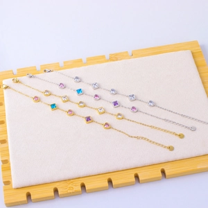 Stack of gold and silver 18K titanium steel bracelets with colorful zircon heart charms